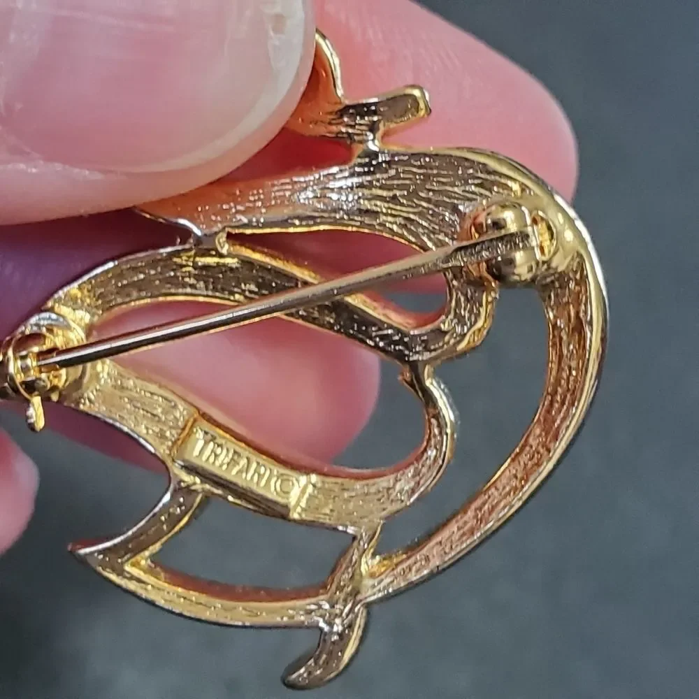 Crown Trifari gold tone swan brooch